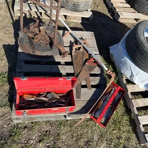4 handsaws, toolbox with misc tools, scythe, forge