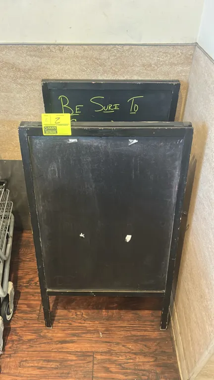 Laminate A-frame chalkboard sign stands. Features folding A-frame construction, black finish frames, and chalkboard display surfaces. 2'W.