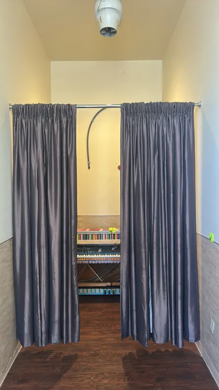 Metal curtain rod with curtains. Features a silver-tone metal rod and two dark gray pleated fabric curtain panels. Dimensions: 6'L. Note: Piano and co