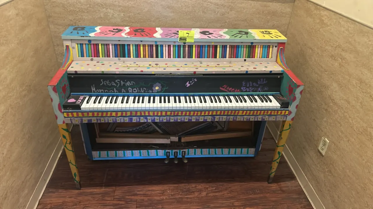 Custom painted upright piano. Features a multi-color hand-painted decorative finish, 88 keys, and 3 foot pedals. Note: Lower front panel is missing, e