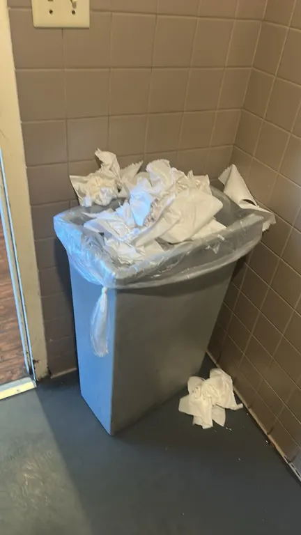 Polyethylene trash bins. Features slim rectangular design and gray molded plastic construction. Contents not included.