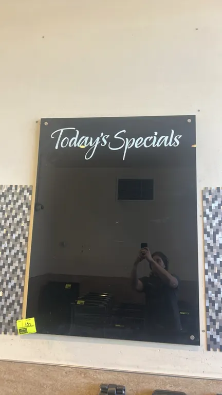 Black glass dry erase board. Features "Today's Specials" script header graphic. Designed for wall mounting with standoff hardware. 3' x 4'.