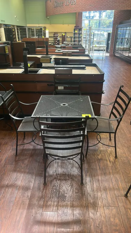 Metal patio dining table and chairs set. Includes (1) 30" metal square table with expanded mesh top and center umbrella hole and (4) matching metal ar