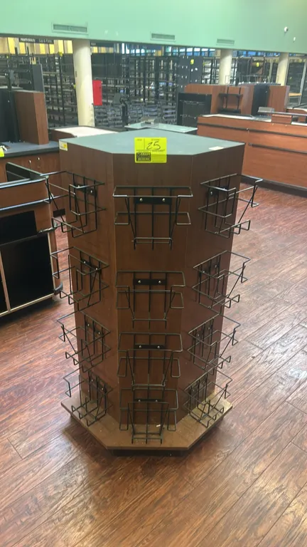 Laminate 3-sided display merchandiser. Features woodgrain laminate finish, unfinished back, and 12 black wire literature/product baskets (4 per side).