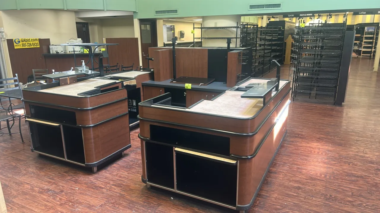 2015 Accent Industries Express U-shaped 2-sided checkout lane. Features woodgrain laminate finish, black bumper rails, scanner cutouts, center storage