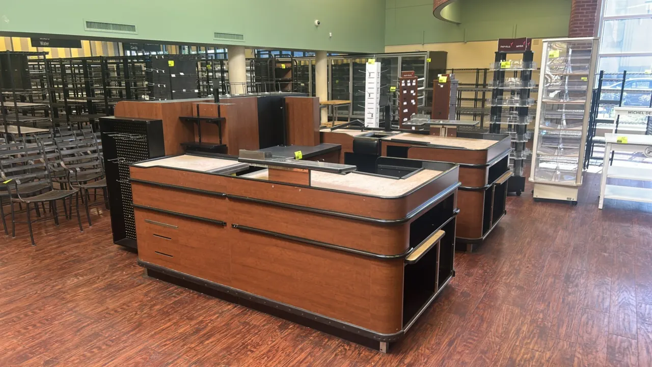 2015 Accent Express U-shaped 2-sided check lane. Features woodgrain laminate construction, dual checkout stations, lower storage cabinets, open underc