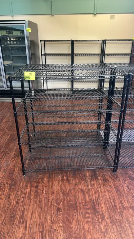 Metro multi-tier wire shelving rack. Features (5) adjustable wire shelves in a black finish. Dimensions: 48" x 20". Mounted on leveling feet.