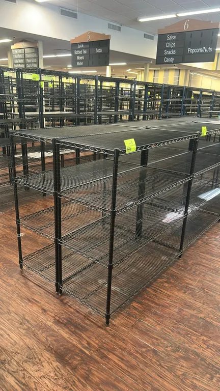 Metro multi-tier wire shelving racks. Features black wire construction with (4) adjustable shelves each. Dimensions: 48" x 20". Mounted on leveling fe