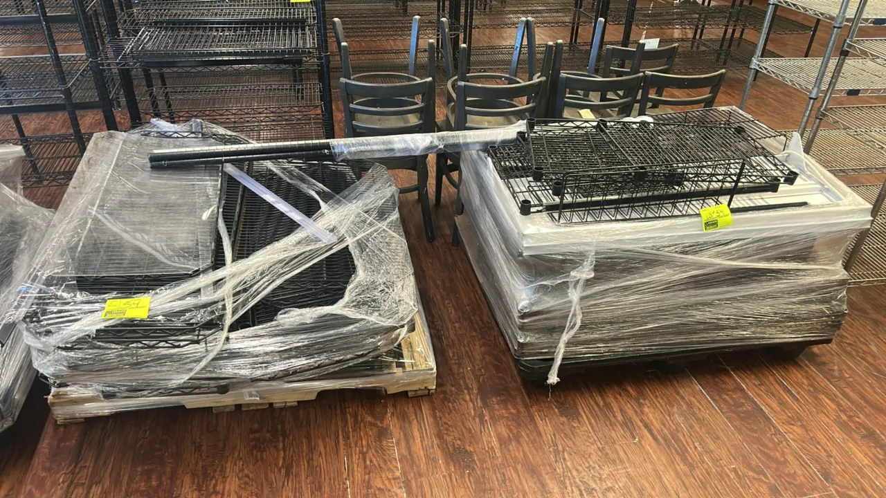 Pallets of metal wire and solid shelving. Includes assorted wire shelves, solid metal shelves, upright posts, wire baskets, and remaining pallet conte