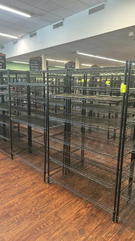 Metal wire multi-tier shelving racks. Features black-finished wire construction and multi-tier adjustable shelves. Dimensions: 48" x 18".