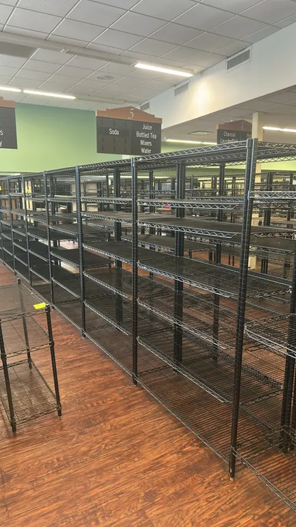 Metro metal wire multi-tier shelving racks. Features black wire construction and adjustable multi-tier wire shelves. Dimensions: 48"L x 18"W each.