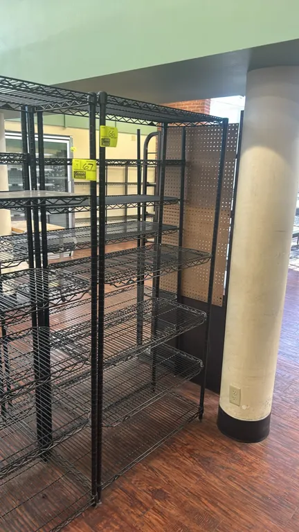 Metro multi-tier wire shelving rack. Features black finish with adjustable wire shelves. Dimensions: 36"W x 18"D.