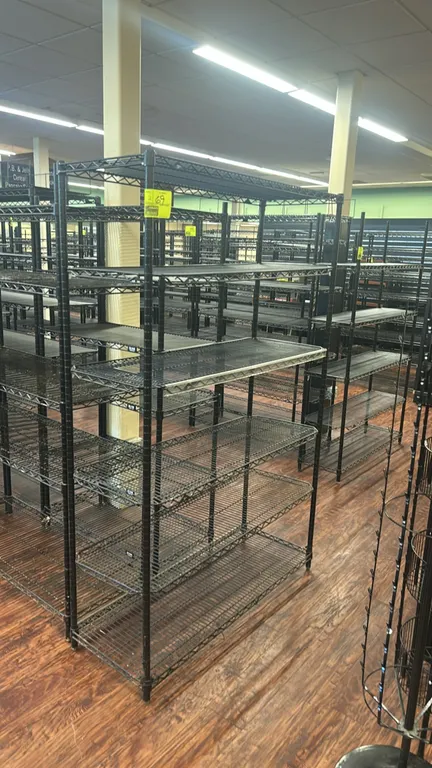 Metro metal wire shelving racks. Features black finish and multi-tier adjustable wire shelves. Dimensions: 48" x 18".