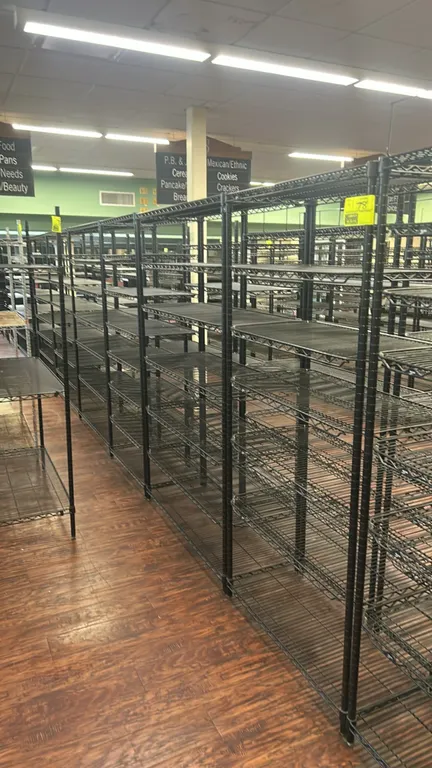 Metro metal wire multi-tier racks. Features black wire construction with adjustable multi-tier wire shelves and grooved upright posts. Dimensions: 48"