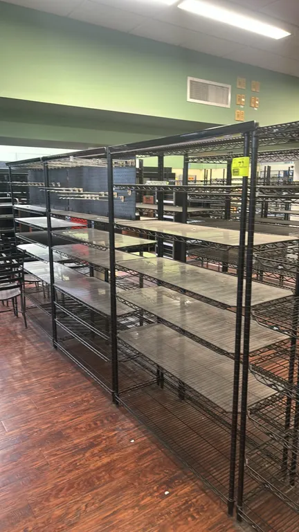 Metro metal wire multi-tier racks. Features black wire construction, multi-tier adjustable shelves, and clear plastic shelf liners. Dimensions: 48" x