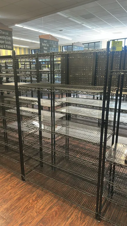 Metro metal wire multi-tier shelving racks. Features black wire construction, multi-tier adjustable shelving, and clear shelf liners. Dimensions: (4)