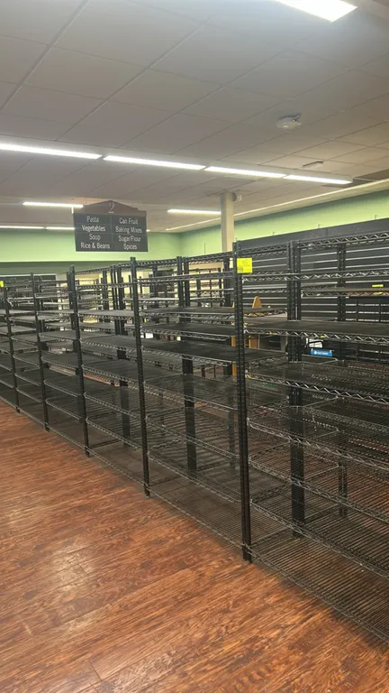 Metro metal wire multi-tier shelving racks. Features black finish, multi-tier adjustable wire shelves, and round tubular upright posts with leveling f