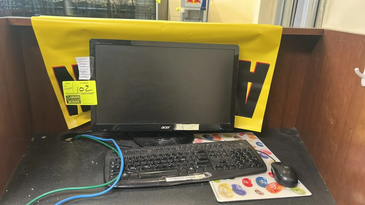 Acer 20" LED monitor. Mounted on desktop stand. Includes Logitech keyboard and HP wired optical mouse.