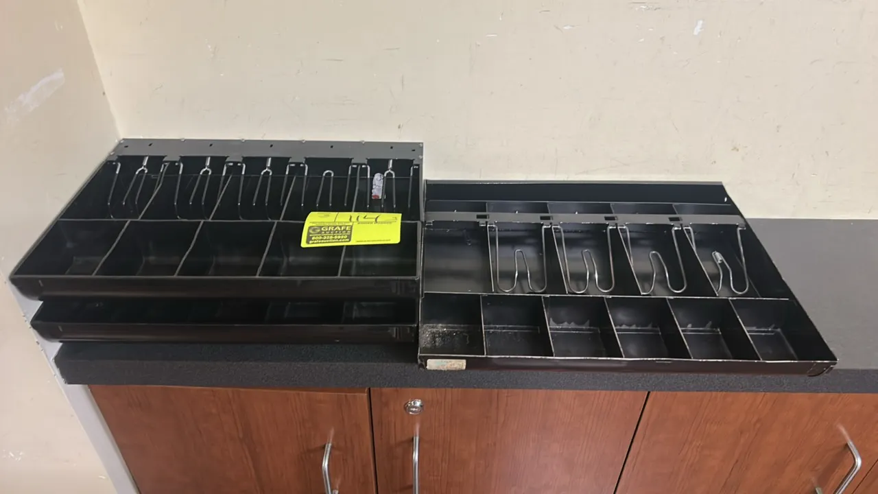 Poly cash drawer till insert trays. Features divided bill compartments with wire hold-down clips and multiple coin compartments. Black plastic constru