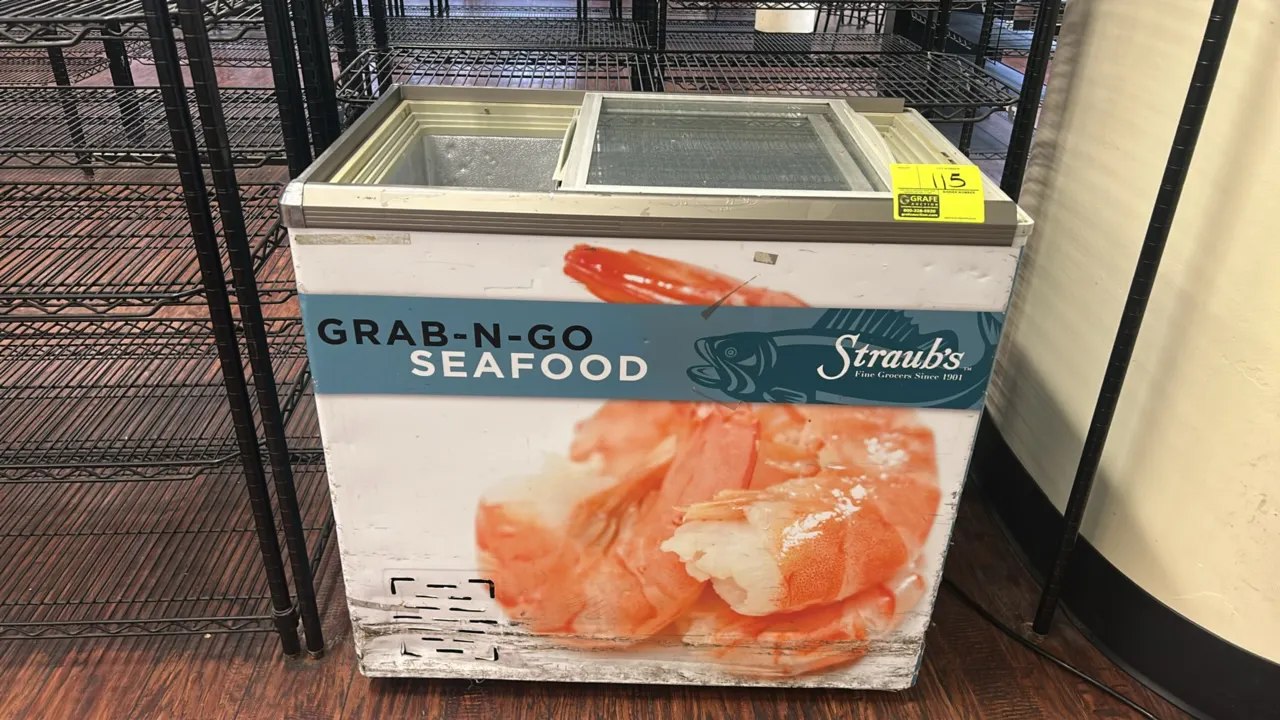 Self-contained spot display freezer. Features sliding glass lids, embossed interior liner, and exterior vinyl wrap. Electrical: standard plug attached