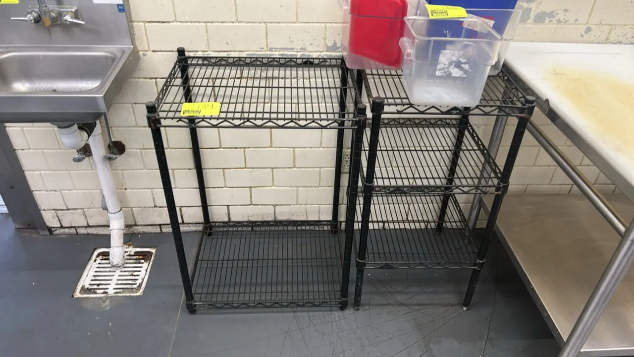 Metro metal wire shelving racks. Includes (1) 24" x 18" 2-tier rack and (1) 18" x 18" 3-tier rack. Features black finish wire construction. Contents n