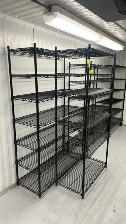 Metro multi-tier wire shelving racks. Features black finish, multi-tier adjustable wire shelves, and upright posts. Dimensions: 36" x 18" and 48" x 18