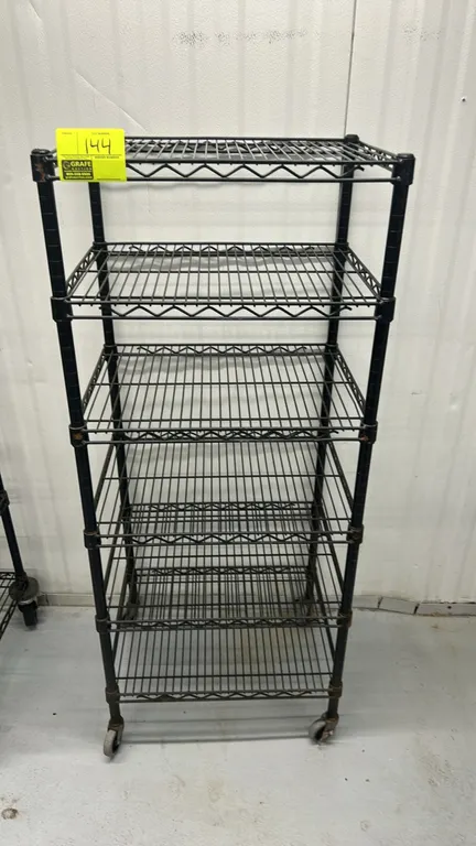 Metro mobile wire shelving rack. Features (6) adjustable wire shelves in a black finish. 24" x 18". Mounted on casters.