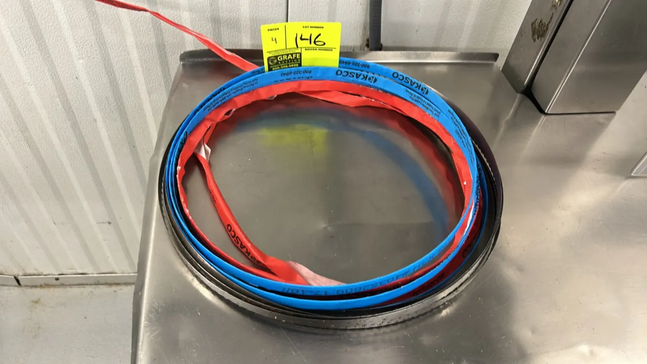 Kasco band saw blades. Features coiled steel construction with protective edge wrapping. Labeled 128 K3H.