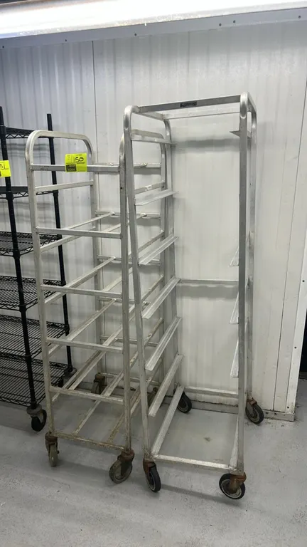Aluminum full-size front-load mobile racks. Features welded aluminum construction with angle slides and tubular shelf runners. Mounted on swivel caste