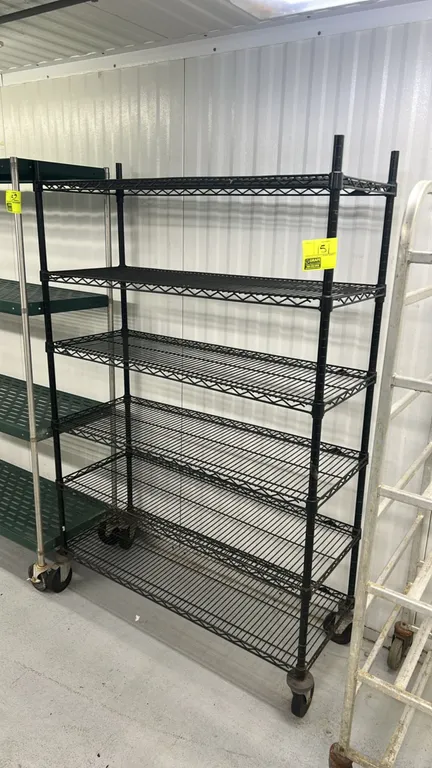 Metro metal wire shelving rack. Features (6) adjustable wire shelves with a black epoxy finish. 48"L x 18"W. Mounted on swivel casters with protective