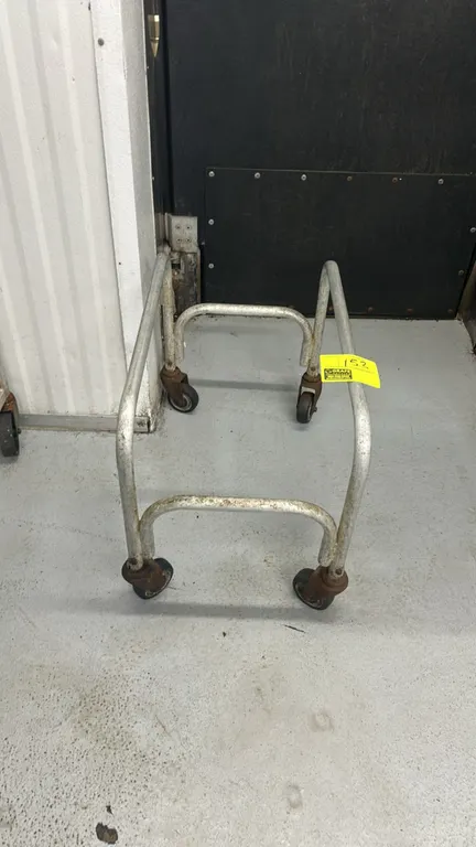 Aluminum meat lug cart. Features tubular aluminum construction designed to hold a standard meat lug. Mounted on swivel casters.