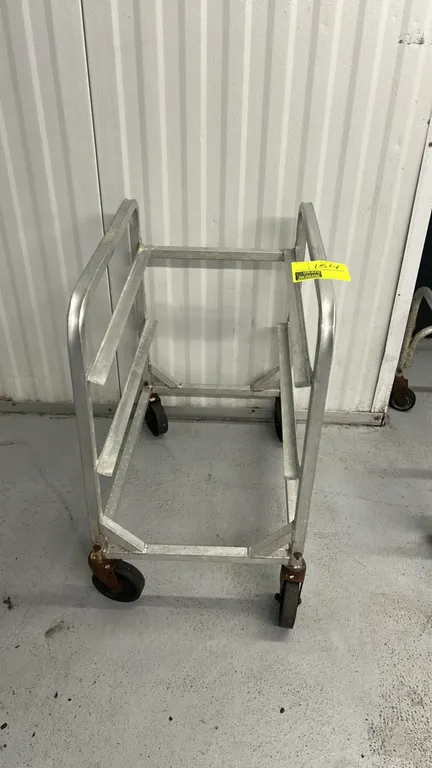 Aluminum half-size front-load channel rack. Features welded aluminum construction with angle pan slides. Mounted on casters.