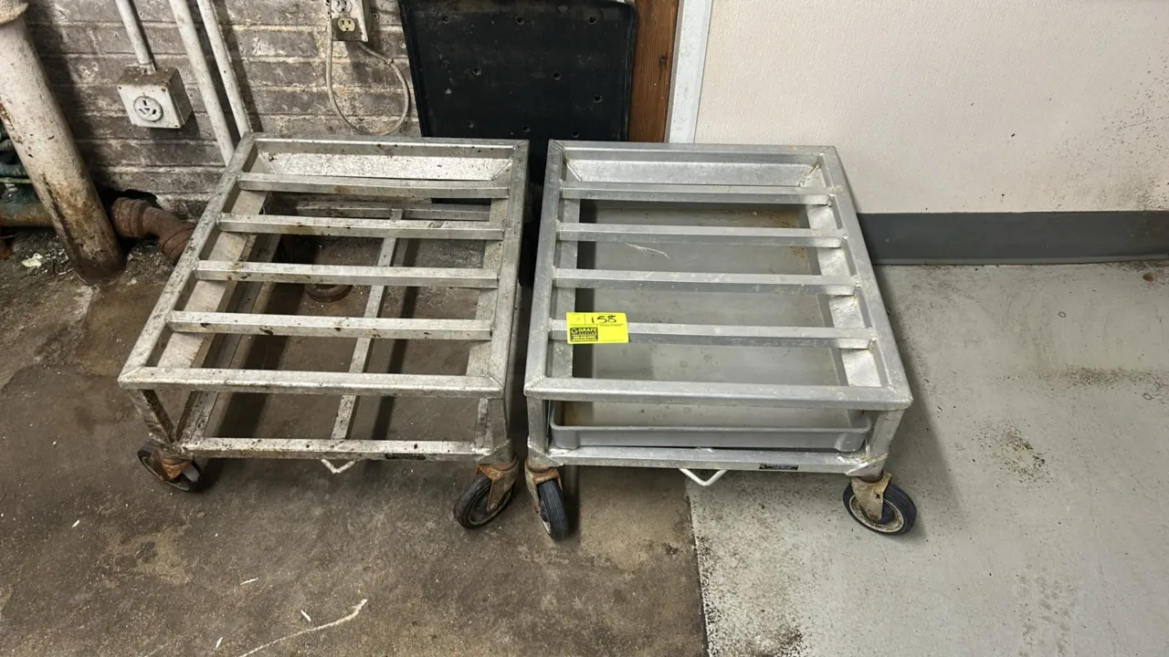 Aluminum portable dunnage racks. Features welded construction and slatted tops. 27" x 24". Mounted on casters. Includes one lower tray.