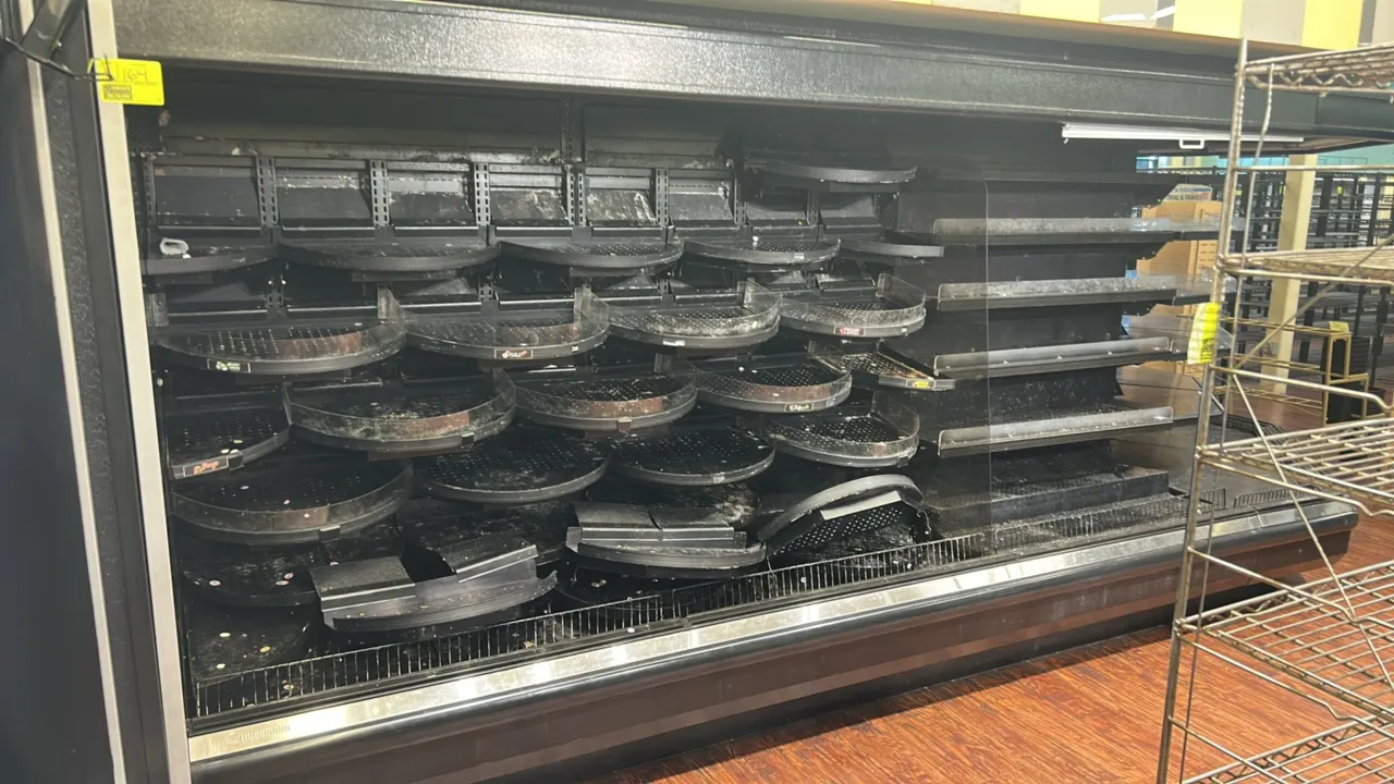 Hussmann D5X-12LE remote multi-tier produce display case. Features solid shelving and interior lighting. Dimensions: 12'L (sections: 12'L, 8'L, 4'L).