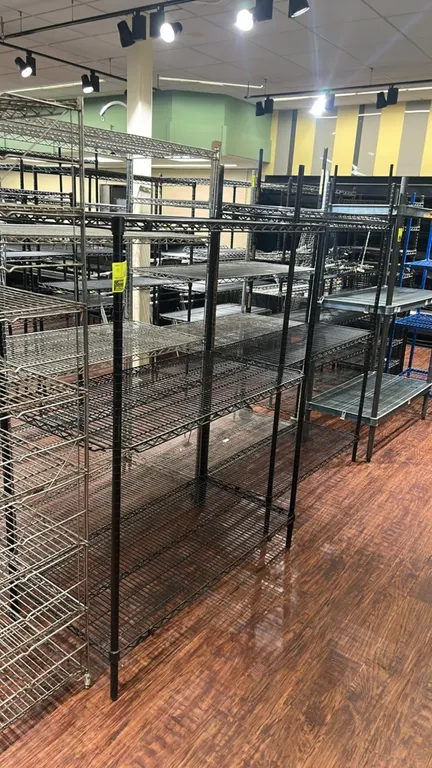 Metro metal wire multi-tier shelving racks. Features adjustable wire shelves. Dimensions: 48" x 18" and 48" x 24".