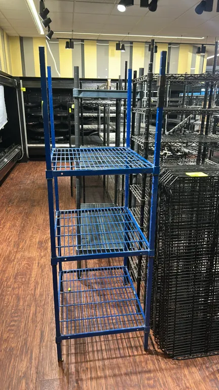 3-tier metal wire shelving rack. Features blue finish and (3) wire shelves. Dimensions: 30" x 24".
