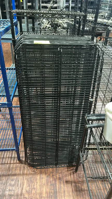 Metro metal wire rack shelves. Features black finish wire construction. 48" x 24". Posts and surrounding shelving not included.