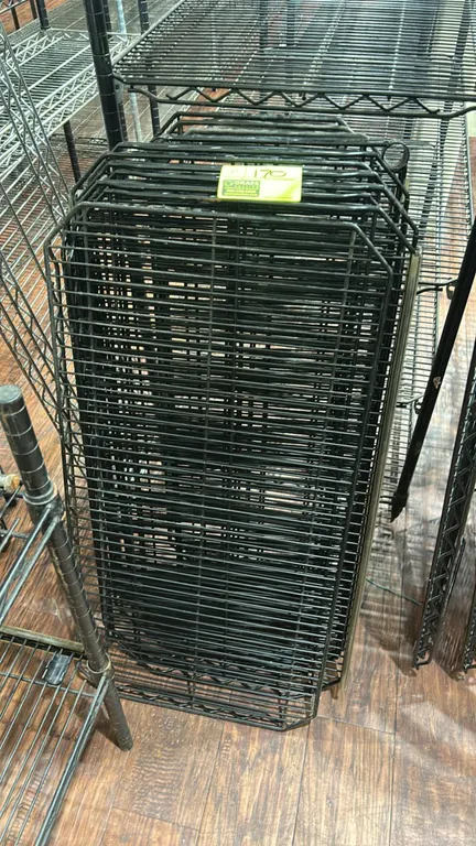 Metro metal wire rack shelves. Features black wire construction with corner collar mounts. Includes (9) 36" x 18" and (4) 48" x 18" shelves. Surroundi
