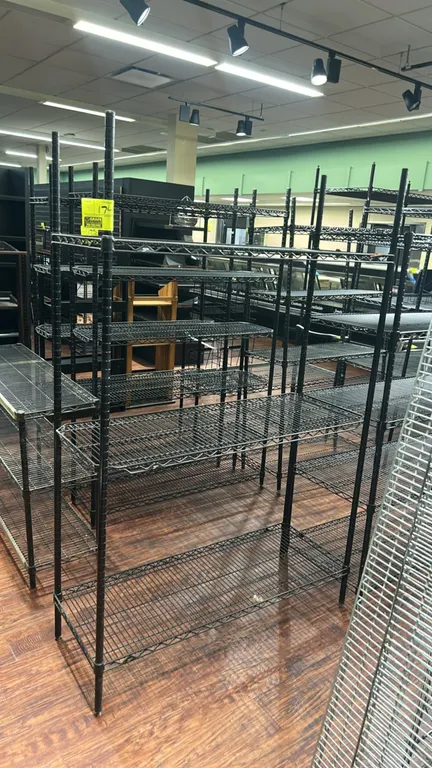 Metro metal wire multi-tier racks. Features black finish, adjustable wire shelving, and tubular upright posts with leveling feet. Dimensions: 48" x 18