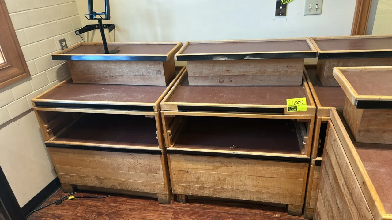 Wooden 3-tier display merchandisers. Features wood construction, tiered display levels, and black front edge molding. 36" x 30".