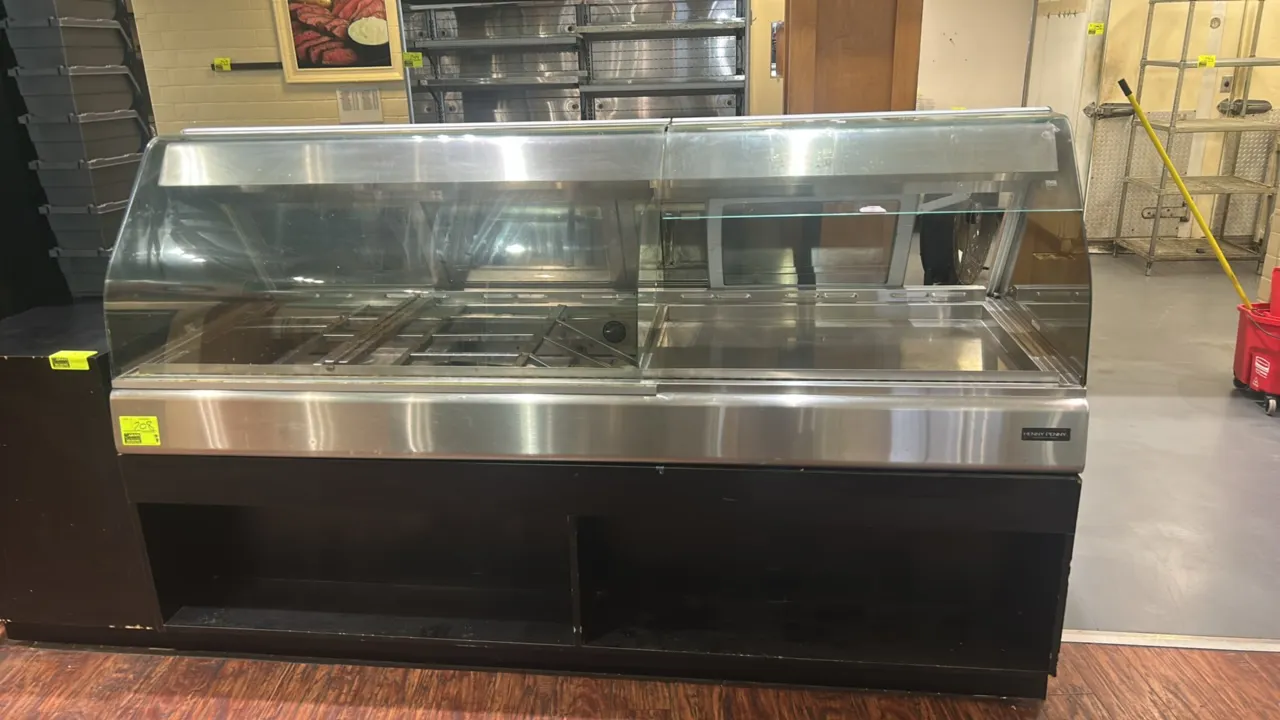 Henny Penny HMR-107 heated display case and self-service warming station. Stainless steel construction with curved glass front, rear sliding glass doo