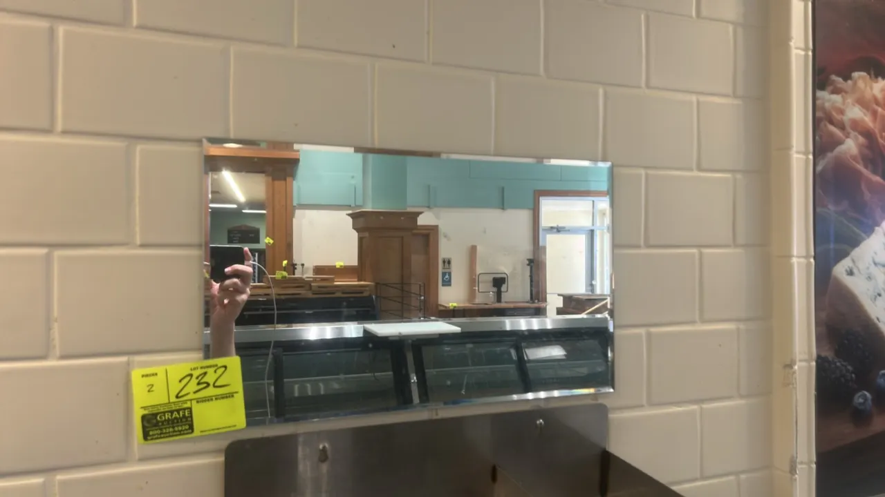 Wall-mounted mirrors. Features rectangular frameless glass construction. Sinks not included.