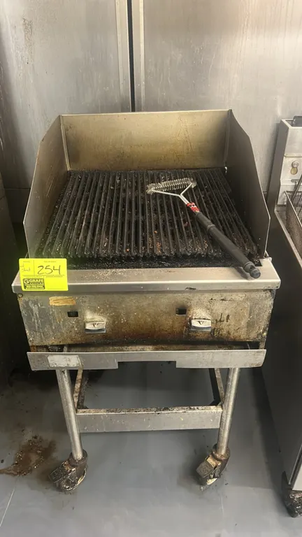 Commercial gas charbroiler. Features stainless steel construction, cast iron grates, 2 burner controls, 3-sided splash guard, and pull-out grease draw