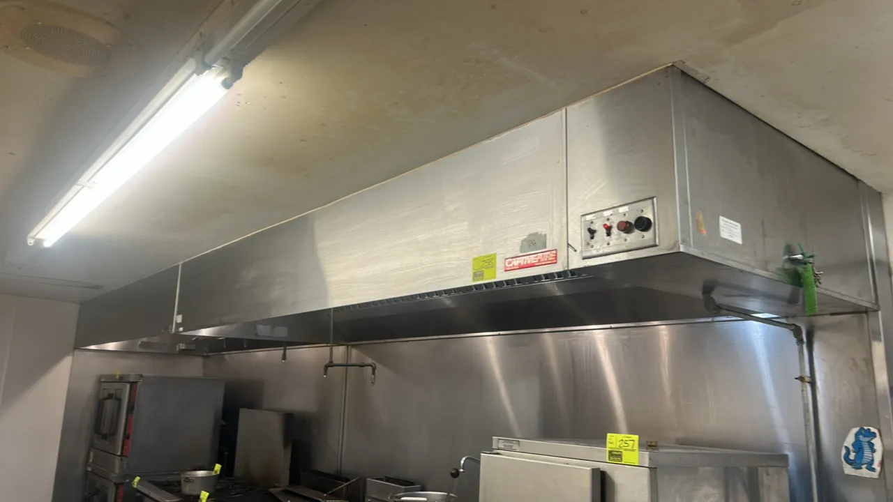 CaptiveAire stainless steel commercial exhaust hoods. Features stainless steel baffle grease filters, integrated canopy lighting, and fire suppression