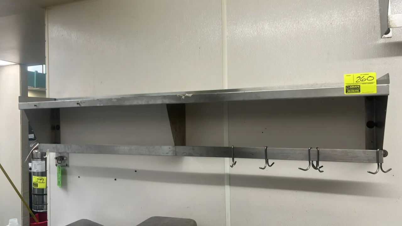 Stainless steel wall-mounted dish rack. Features stainless steel construction, side support brackets, and an integrated lower bar with four hanging ho