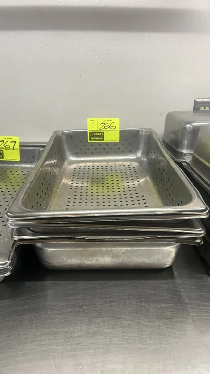 Metal full-size perforated food pan inserts. Features perforated bottom and sidewalls. 4"D. Other pans and equipment shown not included.