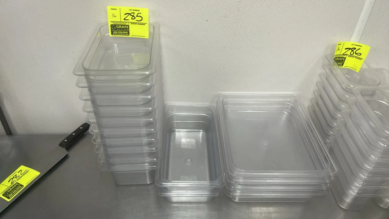 Polycarbonate food insert pans. Features clear plastic construction with stacking rims. Includes (10) 10" x 6" pans, (2) 13" x 7" pans, and (4) 13" x
