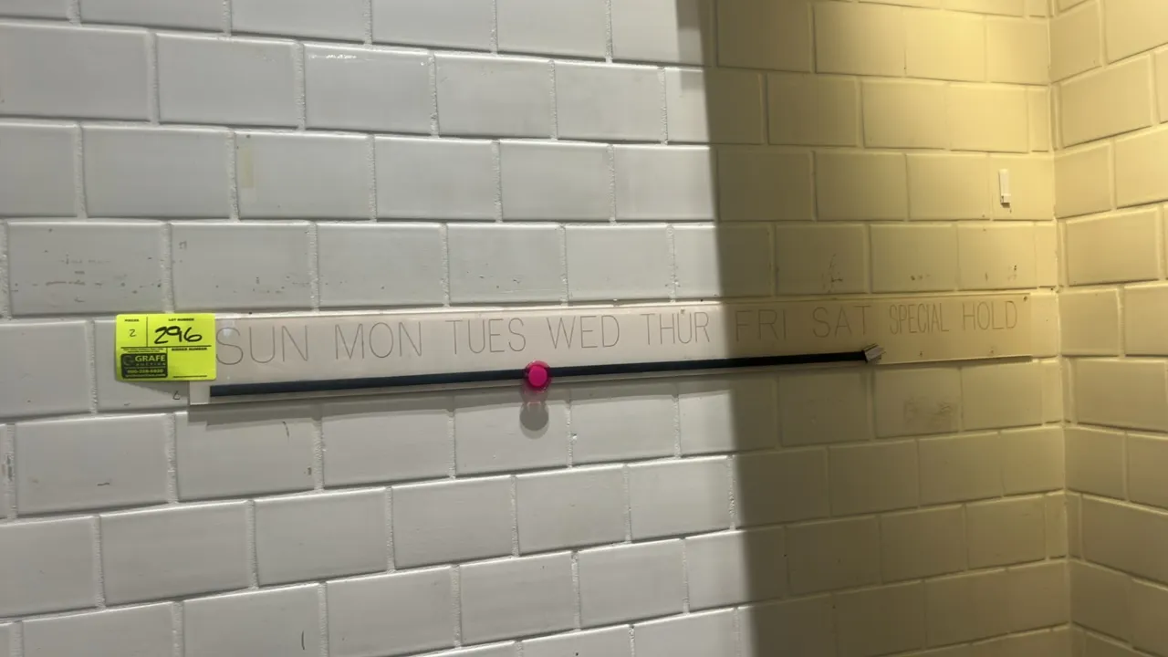 Wall-mounted schedule organizer. Features labeled sections for Sun through Sat, Special, and Hold with lower retention rail. 4'L.