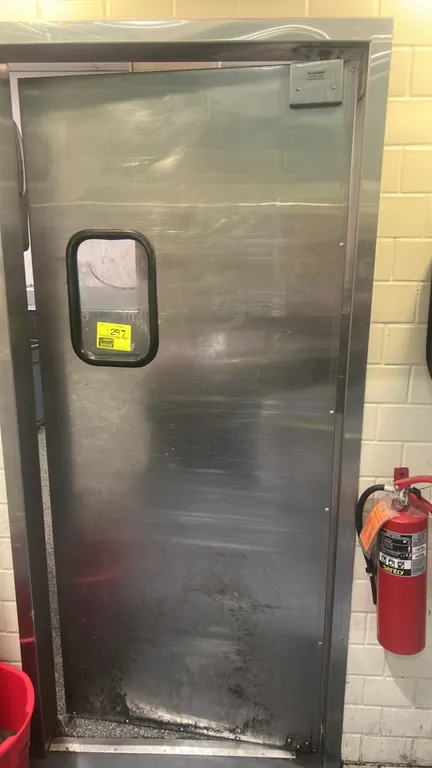 Eliason stainless steel swing door. Features acrylic vision panel window, Eliason top pivot hinge hardware, and stainless steel door frame. 35"W x 82"