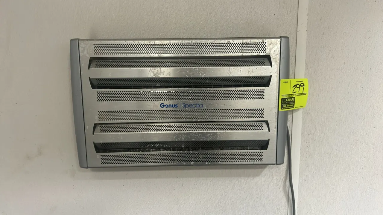 Genus Spectra wall-mounted insect light trap. Features a silver-tone perforated front housing and attached power cord.